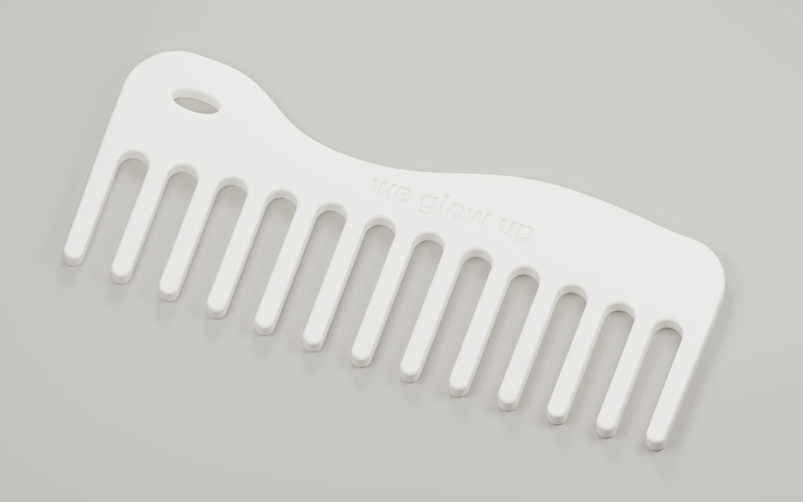 Bone-white CAD render of the Wave comb with an asymmetric spine, oval hanging loop and thirteen rounded teeth