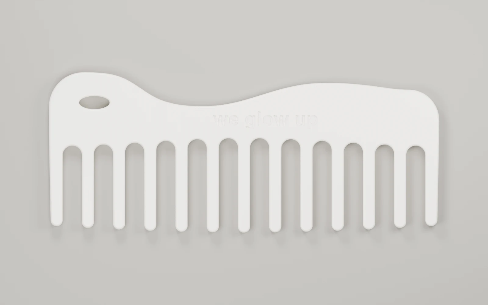 Top CAD view of the Wave comb showing the wide tooth gaps, hanging loop and recessed branding